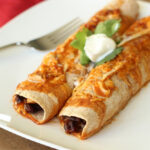 Cheesy Black Bean Enchiladas with Zesty Ranchero Sauce
